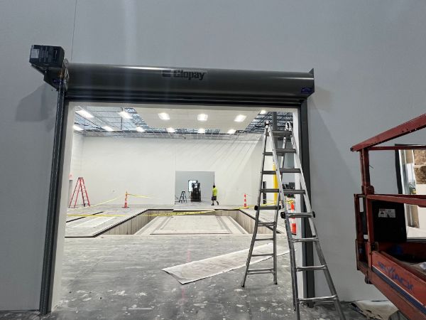 Rolling steel door installation in progress by Altech Doors.