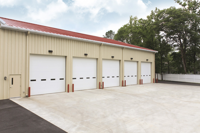 Commercial property with five overhead garage doors.