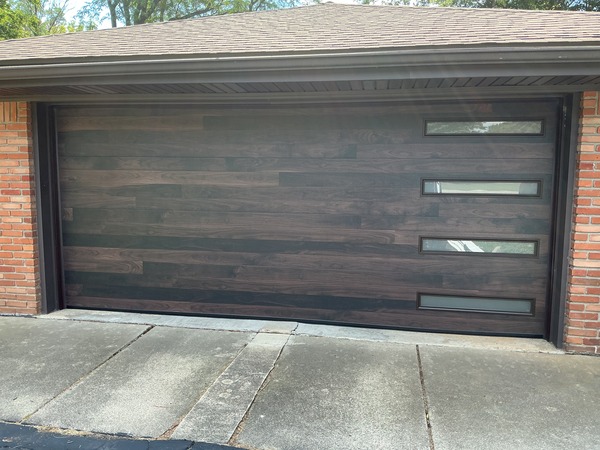 New garage door installation done by Altech Doors. Wood garage door